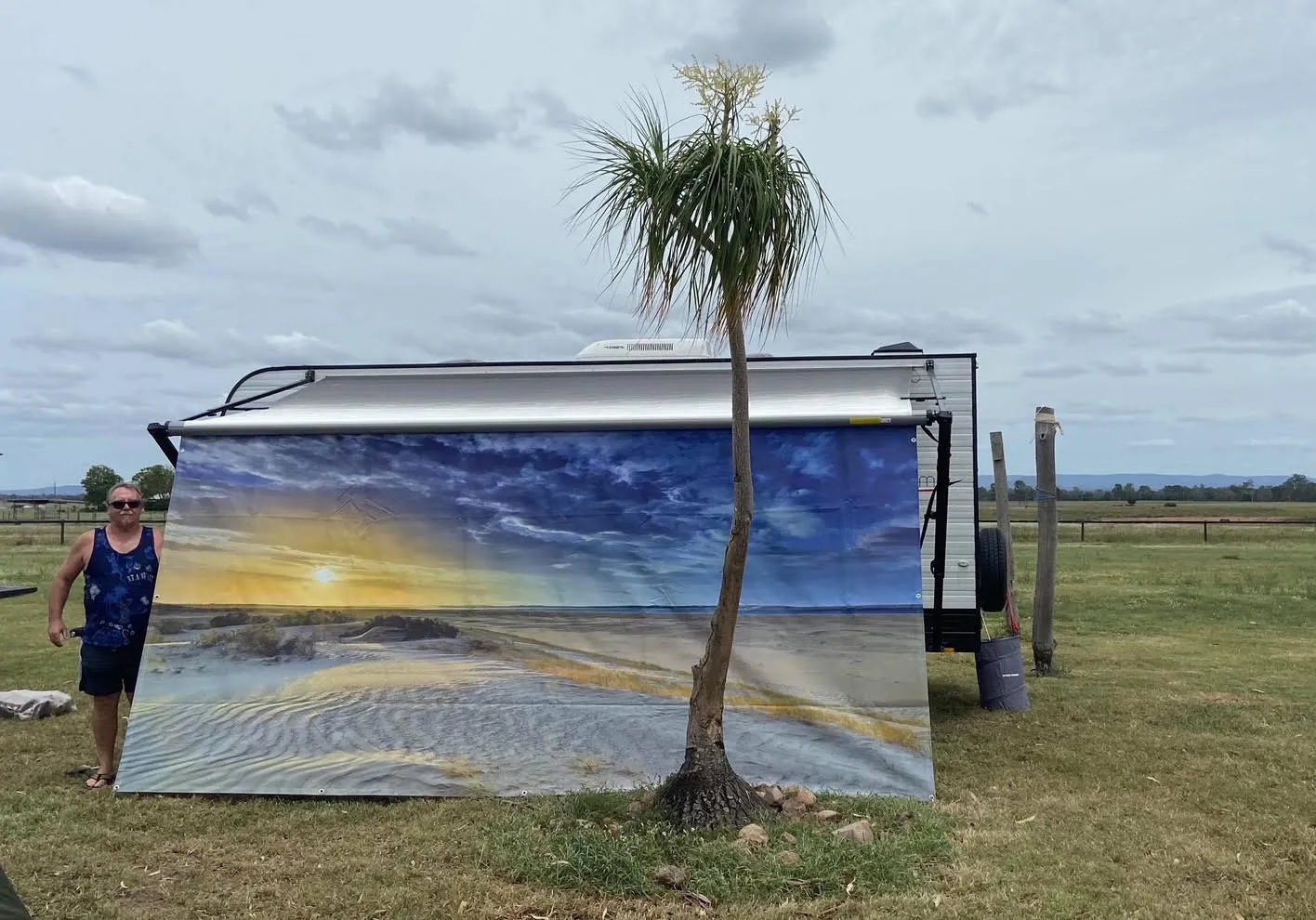 Custom privacy screen with a coastal sunset scene