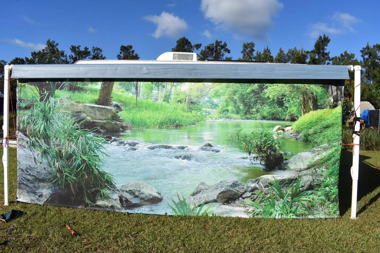 Caravan privacy screen printed with a lush rainforest waterfall
