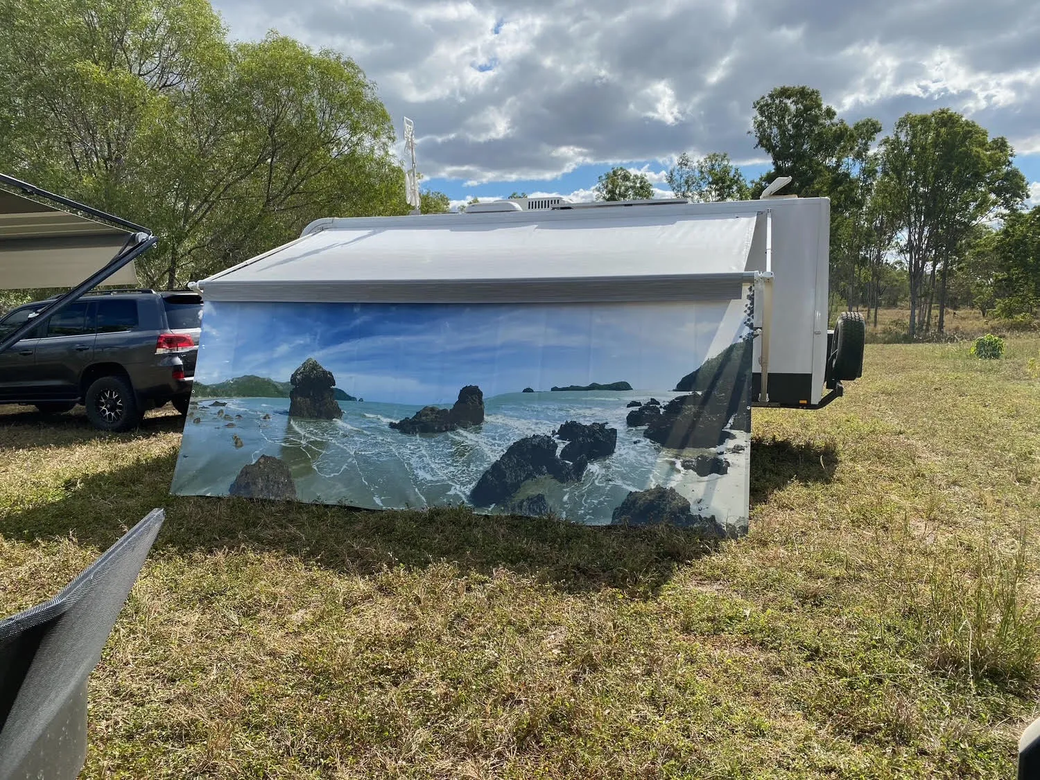 Caravan privacy screen printed with the Twelve Apostles sea stacks at dusk